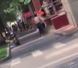 Video Shows Two Chinese Men Strip Off In The Street To