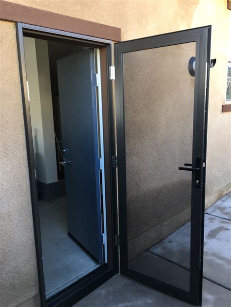 bronze guarda security screen door installed  side garage door summerly homes lake