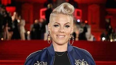 letting go pink ditches her blonde trademark hairstyle for shaven look