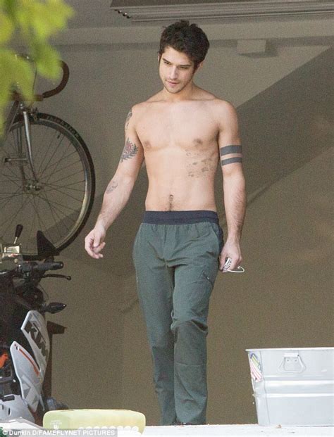 teen wolf s tyler posey goes shirtless showing off his chiseled chest and inked up biceps