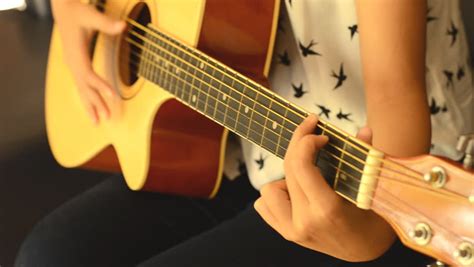 teen girl playing guitar at home stock footage video 3358673 shutterstock