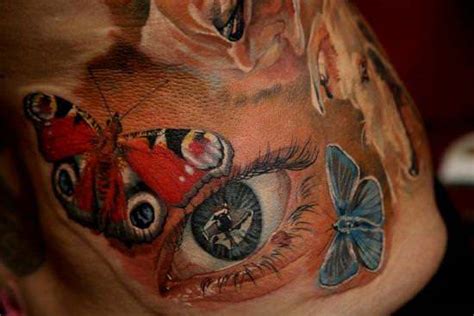 this feminine tattoo of a realistic eye surrounded by