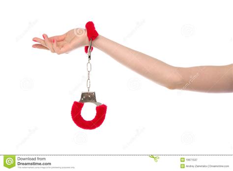 female hand with handcuffs for sex games royalty free