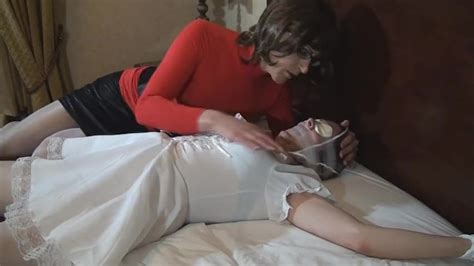 tranny tied tape gagged and spread on bed