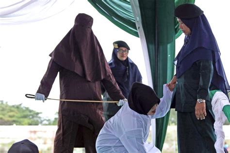 aceh province whipping muslim woman caned in indonesia by sharia law