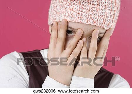 close    girl hiding  face   hands stock photograph gws fotosearch