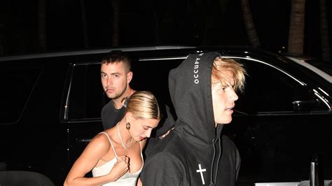 hailey baldwin wears a slip dress at a club in miami with justin bieber