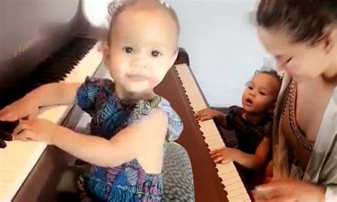 john legend s daughter luna tries her hand on the piano daily mail online
