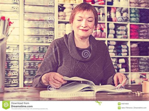 mature female assistant waiting  clients stock image image  diversity needle