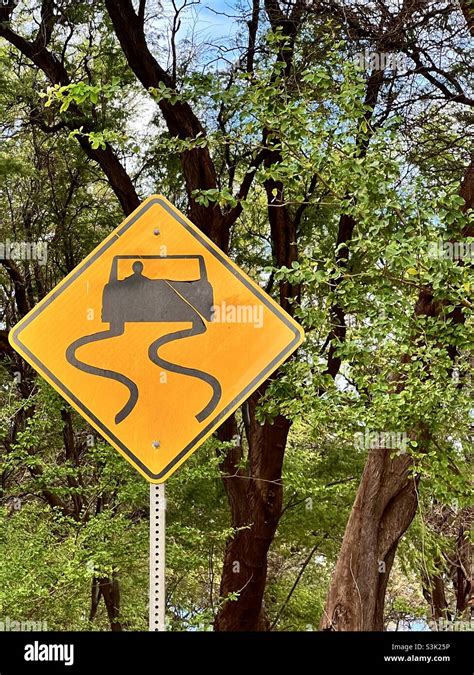 warning road sign for dangerous curves up ahead on a remote country