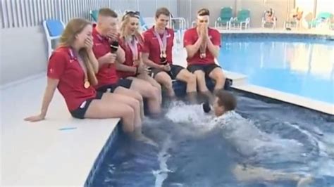 watch sports reporter hilariously fall in pool during live interview