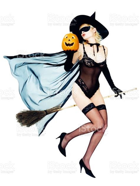 Woman Dressed As Halloween Pinup Witch On Her Broom Stock