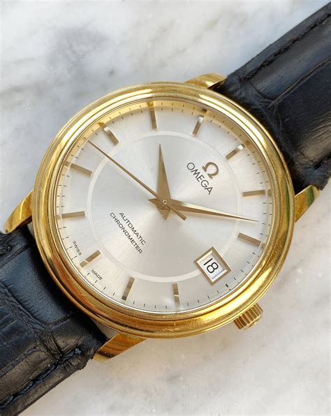 vintage omega automatic chronometer  solid gold sapphire glass vintage portfolio