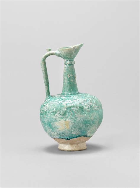 bonhams a monochrome moulded pottery ewer persia 12th 13th century