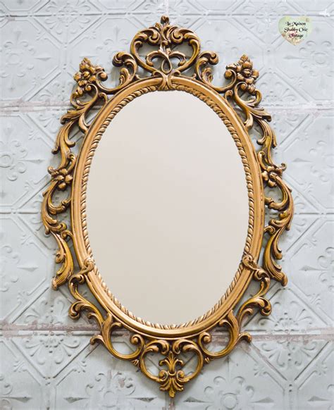 ornate gold framed mirror   wall