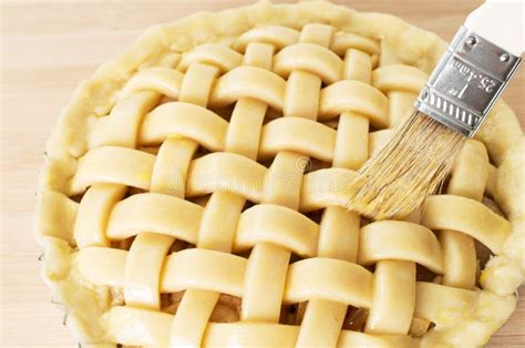apple pie  preparation  tip  brush stock photo image  closeup dessert