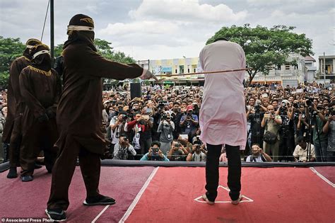 prostitute beaten with a cane in indonesia s final public