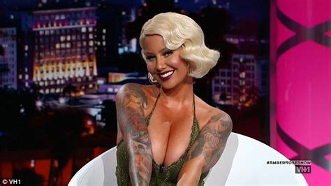 amber rose struggles to contain her ample assets in