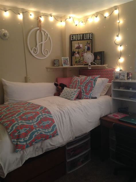 A Bedroom With Lights Strung Above The Bed