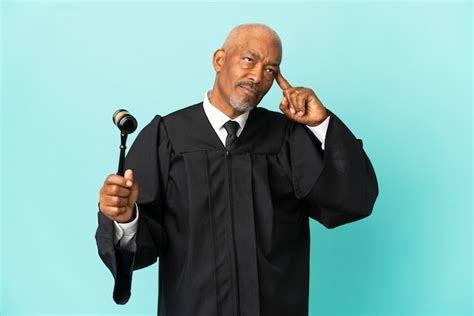 premium photo judge senior man isolated  blue background