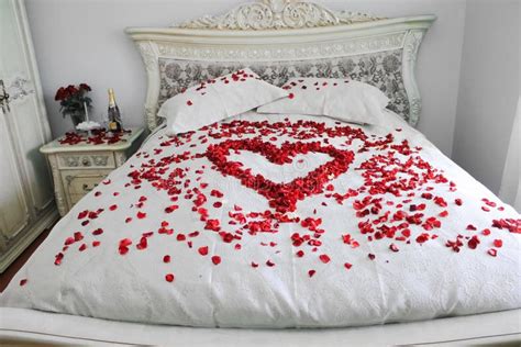 bed  real red rose petals stock photo image  kingsize candles