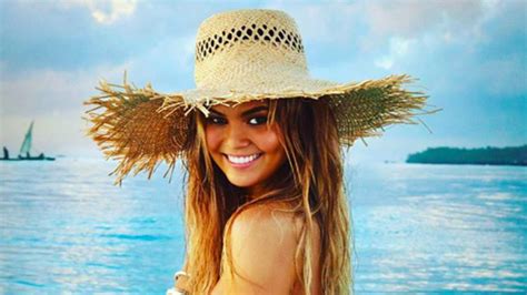 pregnant chrissy teigen strips down to a barely there bikini for sports illustrated swimsuit