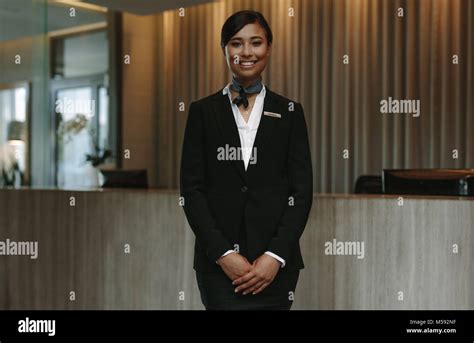 happy smiling female receptionist  hotel beautiful concierge  uniform waiting  welcoming
