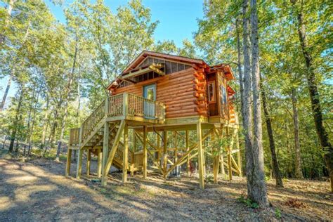 whispering pines log cabin  stilts   cabin tiny house vacation log cabin