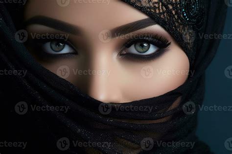 Portrait Of Beautiful Arab Woman With Blue Eyes Wearing Black Scarf
