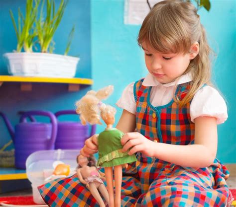 Cute Girl Playing With Toy Doll At Kindergarten Stock Image Image Of