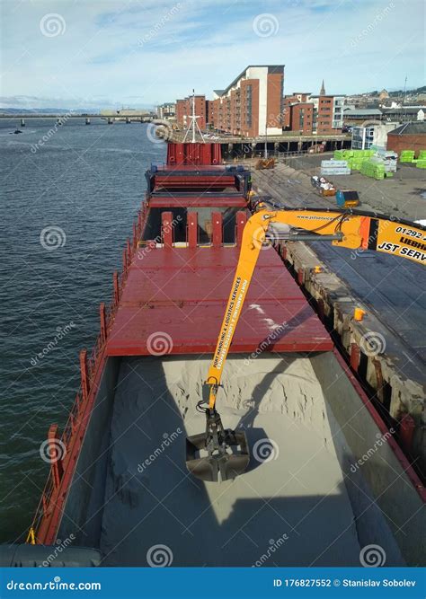 cargo discharging  cargo vessel editorial photography image  vessel river