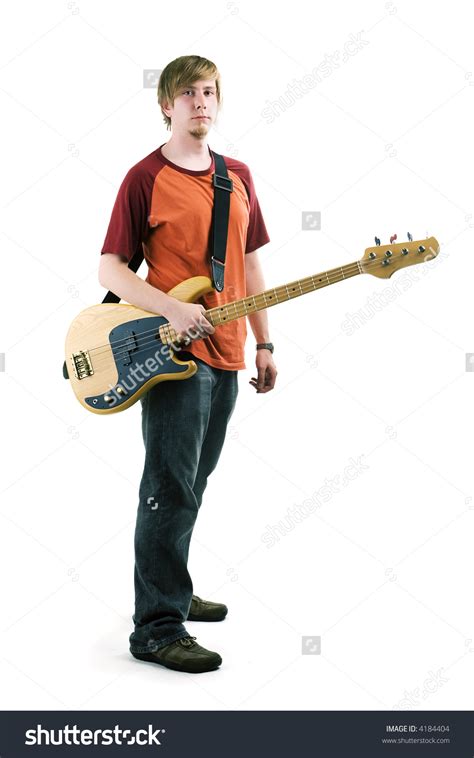 young man playing  bass guitar posing stock photo