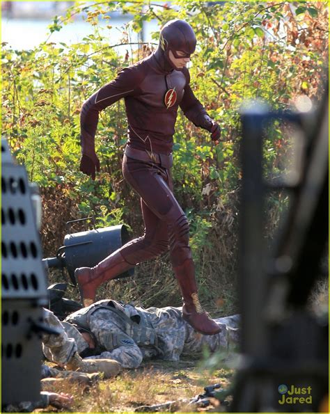grant gustin suits up and strips down for the flash filming in