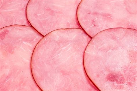 sliced tasty ham background premium photo