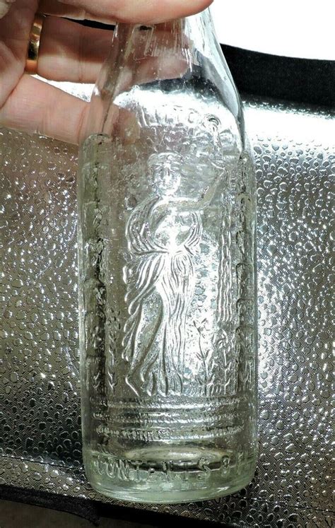 3339~vtg 60 S Embossed Woman Empire Bottling Clear Glass Soda Bottle