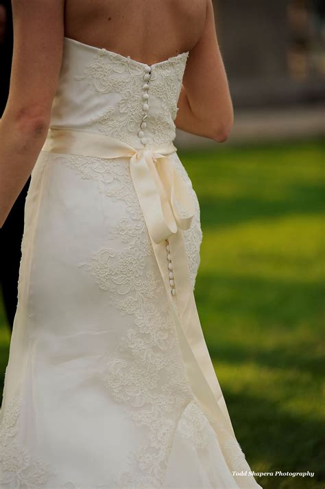 elegant mermaid wedding dress  lace detail  buttons    wedding dresses
