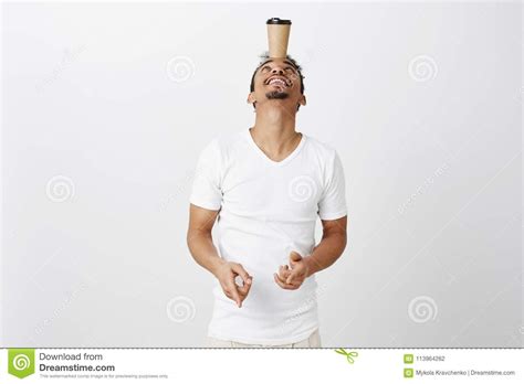 Skillful Guy Showing His Balance Portrait Of Good Looking African