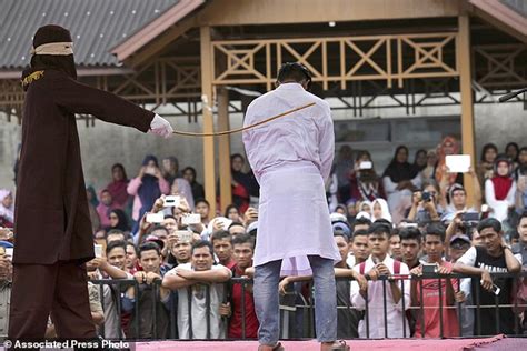 2 men in indonesia s aceh province face caning for gay sex daily mail online