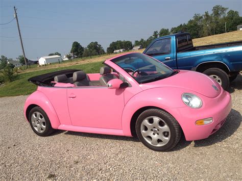 pink convertible volkswagen beetle