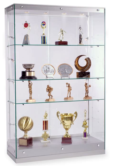 A Glass Display Case Filled With Lots Of Trophies