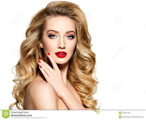 pretty woman with long hair and red nails stock image