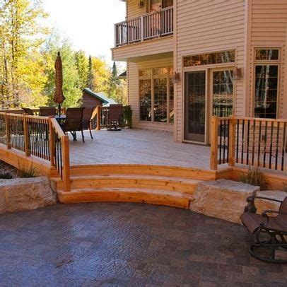 curved step idea leading   stone patio area
