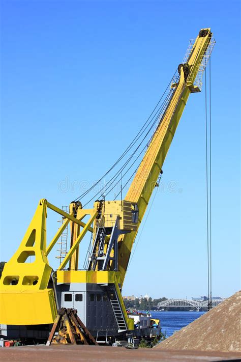 quay crane discharging shipping container  blue sky background stock photo image  harbor