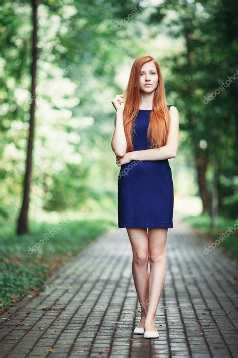 Romantic Cute Redhead Lady In A Blue Dress With A Forest