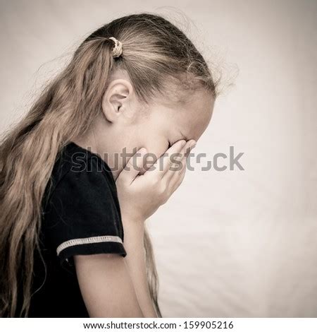 girl covering  face   hands stock photo  shutterstock