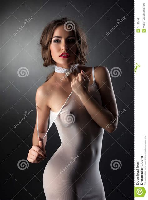 beautiful nude model posing in tight negligee stock image