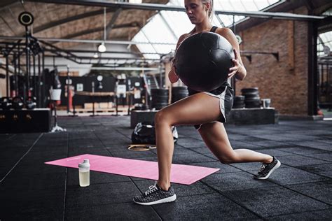 Woman Working Out With A Fitness Ball At The Gym High Quality Sports