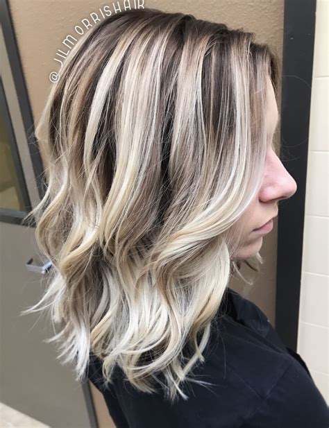 cool icy ashy blonde balayage highlights shadow root waves  curls