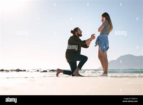 Man Down On One Knee Offering A Surprise To Woman Man Proposing Woman
