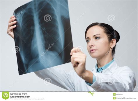 female doctor examining x ray image stock image image of